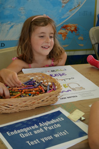 Coloring endangered alphabets at the Smithsonian Folklife Festival, June 2013.