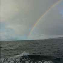 Photo of a rainbow taken from the Armadale to Mallaig ferry in May 2016 by Simon Ager
