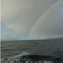 Photo of a rainbow taken from the Armadale to Mallaig ferry in May 2016 by Simon Ager