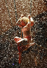 Lass on trapeze in a snow storm