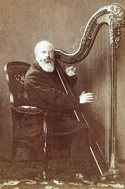Johann Martin Schleyer playing the harp in 1888 from https://commons.wikimedia.org/wiki/Category:Johann_Martin_Schleyer?uselang=de